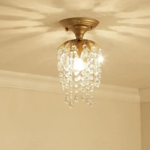 Compact gold crystal flush mount chandelier