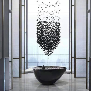 Large crystal stone waterfall chandelier hanging in a modern foyer