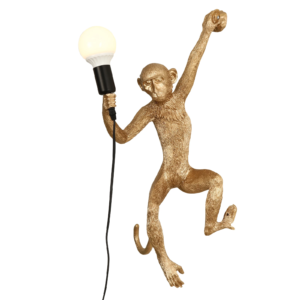 Gold resin monkey wall lamp holding a bulb aloft, climbing pose