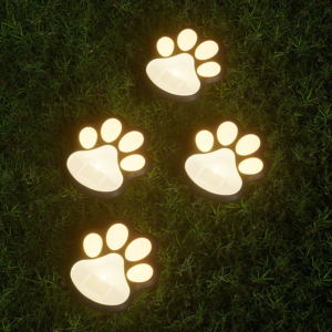 Solar-powered pet paw shaped garden lights, glowing on lawn at night